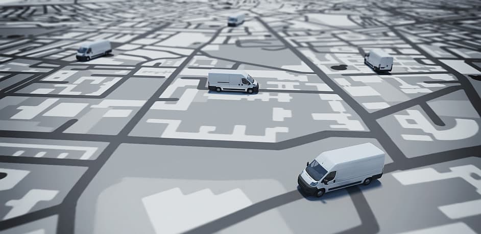 Die Illustration eines verfremdeten Stadtplans mit Lieferwagen die darauf fahren